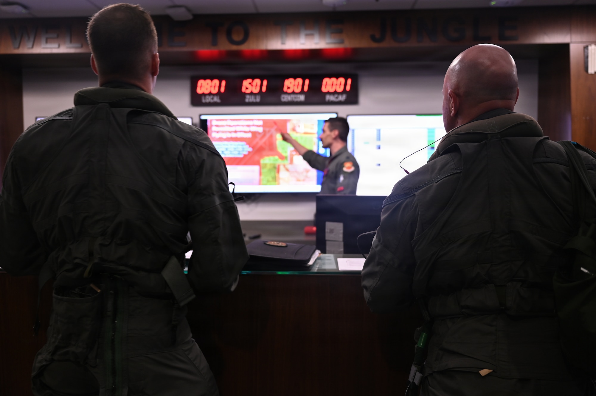 U.S. Air Force Brig. Gen. David Berkland, 56th Fighter Wing commander, right, and a student pilot assigned to the 63rd Fighter Squadron attend a pre-flight brief for a training mission at Luke Air Force Base, Arizona, July 15, 2026.