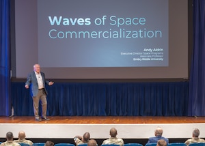 Dr. Andrew Aldrin speaks with attendees for a presentation.