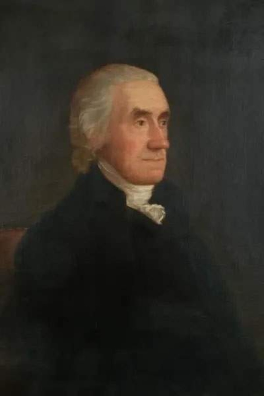 A man wearing a colonial suit.