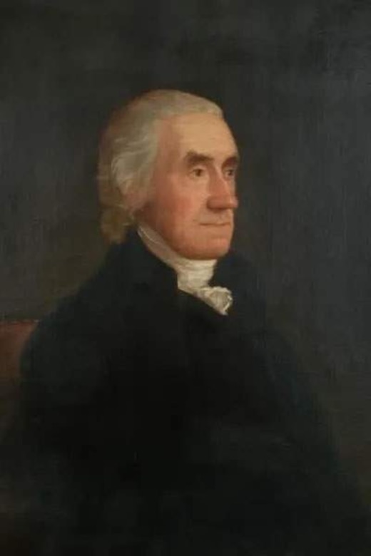 A man wearing a colonial suit.