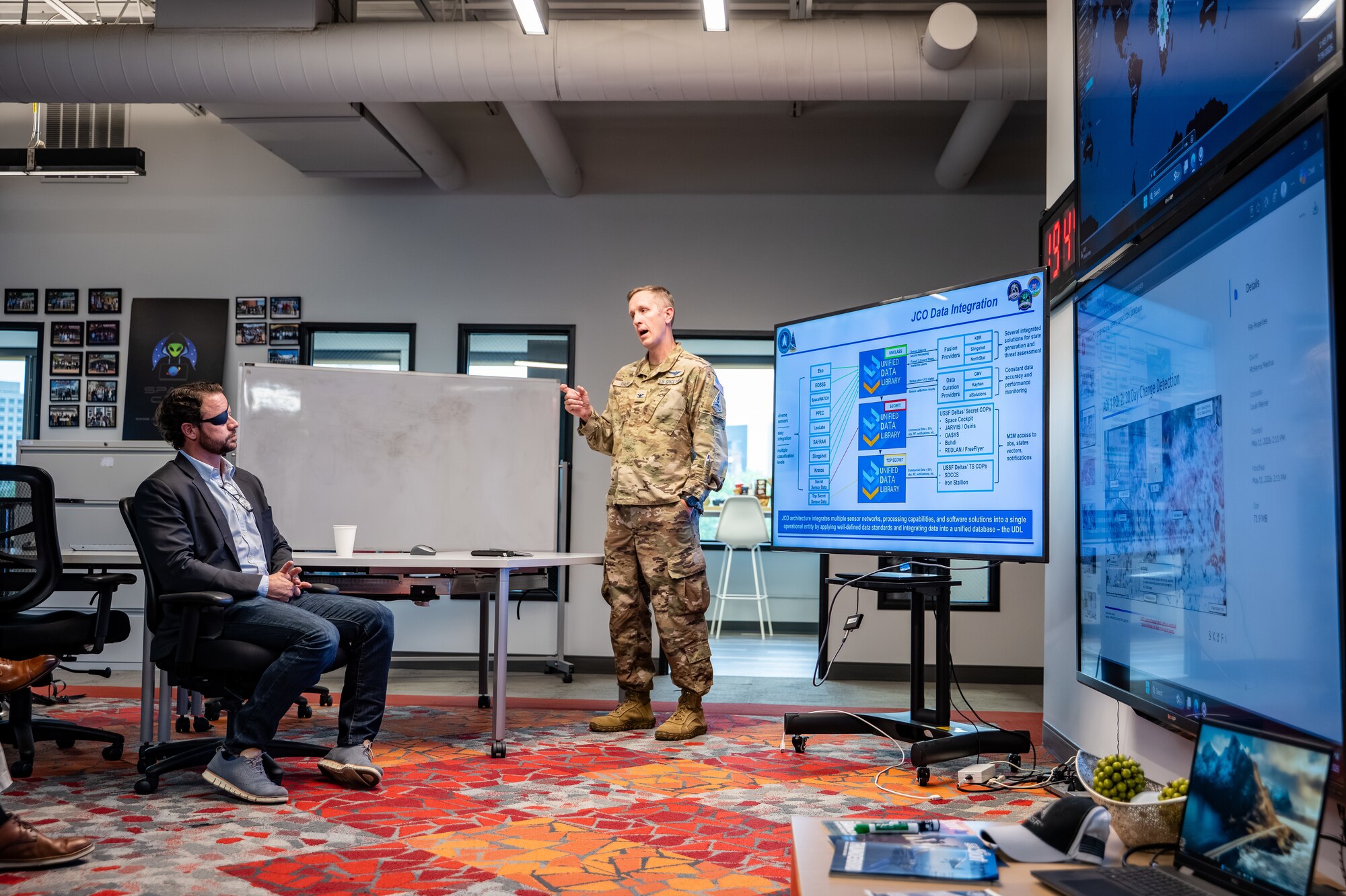 Dan Crenshaw gets a briefing from Col. Galen Thorp