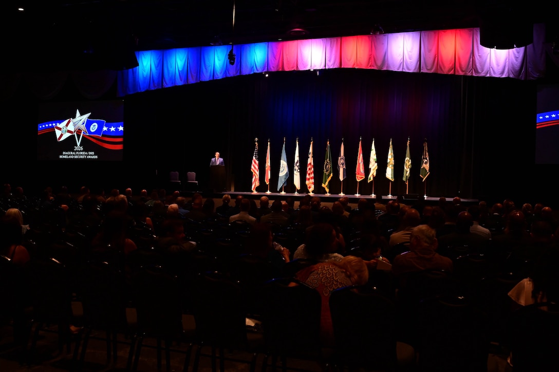 A guest speaker delivers remarks during the inaugural Florida Department of Homeland Security Awards Ceremony at the Clermont Performing Arts Center in Clermont, Florida, July 15, 2026. The event recognized state and federal partnerships as well as individuals nominated for their contribution during joint operations to protect our nation and safeguard the State of Florida in the past year.