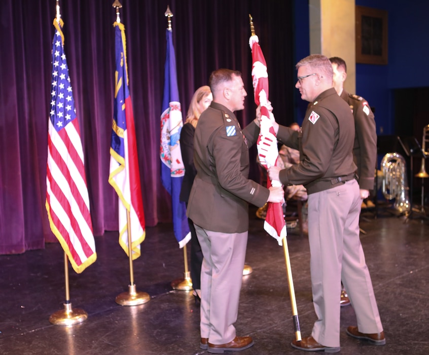 LTC Kenneth Porter accepts the Wilmington District Command Flag from BG Zachery Miller.