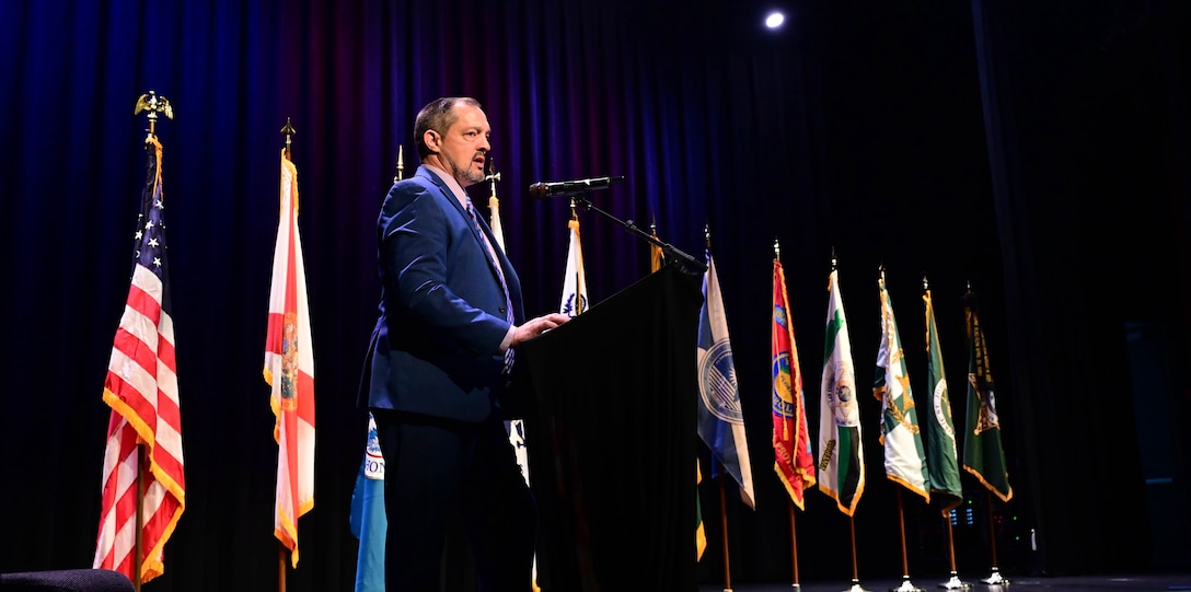 The master of ceremonies delivers remarks during the inaugural Florida Department of Homeland Security Awards Ceremony at the Clermont Performing Arts Center in Clermont, Florida, July 15, 2026. The event recognized state and federal partnerships as well as individuals nominated for their contribution during joint operations to protect our nation and safeguard the State of Florida in the past year.