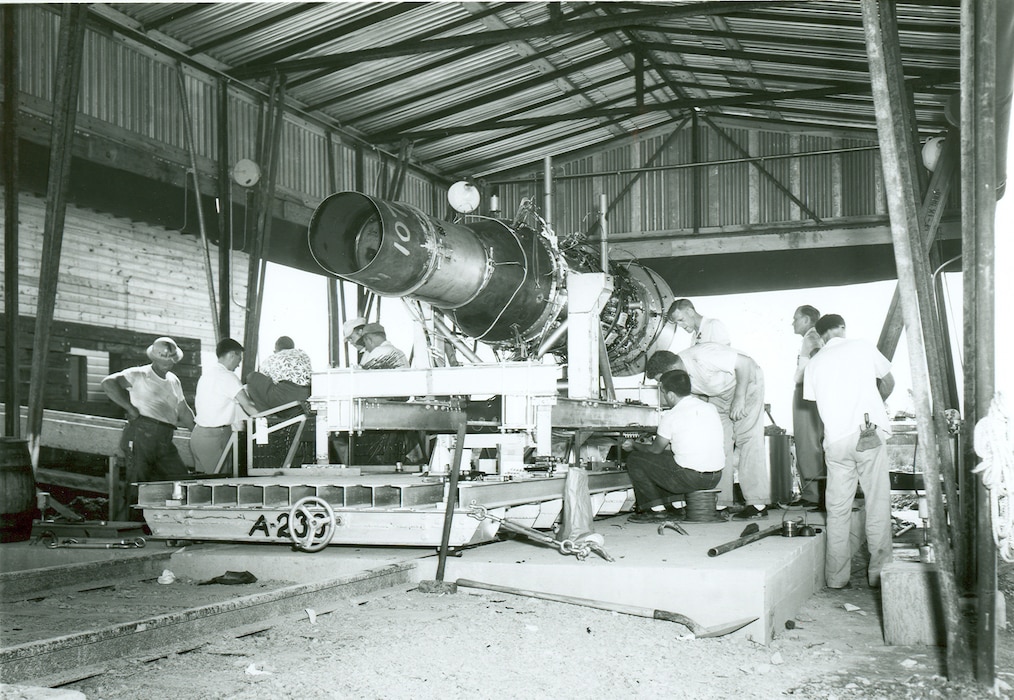 A J-47 engine is prepared for open-air testing prior to being test fired on Aug. 27, 1953. This instrumentation test, which occurred near the then-under-construction Engine Test Facility at Arnold Air Force Base, Tenn., was conducted using a specially designed and constructed thrust stand. The first turbojet engine test conducted at Arnold was initiated on May 3, 1954, in the T-1 test cell of the ETF on a J-47 engine. (U.S. Air Force photo)