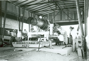 A J-47 engine is prepared for open-air testing prior to being test fired on Aug. 27, 1953. This instrumentation test, which occurred near the then-under-construction Engine Test Facility at Arnold Air Force Base, Tenn., was conducted using a specially designed and constructed thrust stand. The first turbojet engine test conducted at Arnold was initiated on May 3, 1954, in the T-1 test cell of the ETF on a J-47 engine. (U.S. Air Force photo)