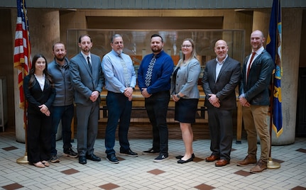 Naval Surface Warfare Center, Philadelphia Division’s (NSWCPD) Helo Hangar Door Team has been named a recipient of the NAVSEA Readiness Generation Award. (L-R) Mariah Schmelzle, Daniel Turek, James Case, Kenneth Poole, Salvatore DeSantis, Kristen Bradshaw, Patrick Violante, and Philip T. Greiner. Team members not present: Randall Kern, Allison Hice, and Tyler Sutton. (U.S. Navy photo by Jay Butterbaugh, CTR)