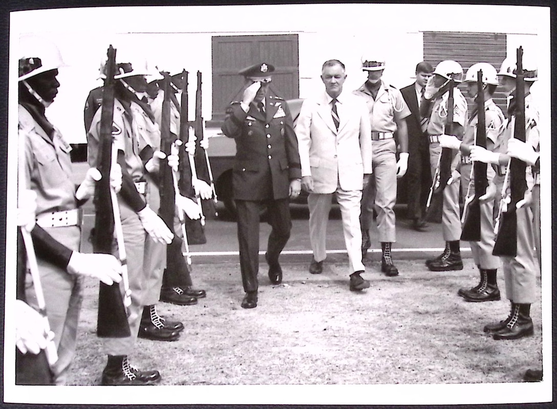 Dedication of the U.S. Army Transportation Museum. (Left to Right) U.S. Army Maj. Gen. Alton G. Post, Fort Eustis commander, and Honorable Mills P. Godwin, Governor, Commonwealth of Virginia, as they cut ribbon by spinning the wheel. (Courtesy photo by C.E. Williams, David Byrd, TASO Photo, from U.S. Army Transportation Museum Photo Collection)