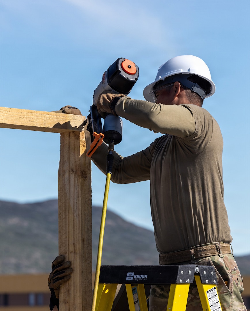 A New York Army National Guard Soldier assigned to the 1156th Engineer Company constructs a new pitched roof over an existing flat roof at a lodging facility in Kangerlussuaq, Greenland, June 15, 2026.