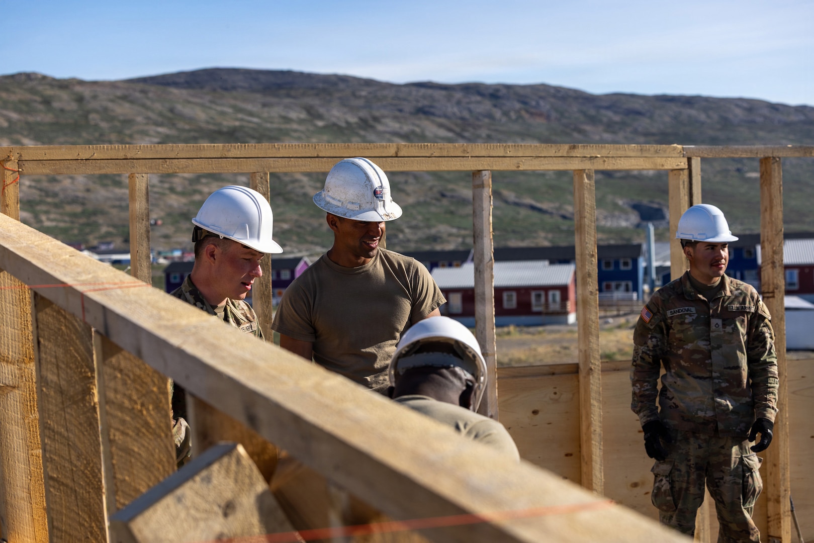 New York Army National Guard Soldiers assigned to the 1156th Engineer Company construct a new pitched roof over an existing flat roof at a lodging facility in Kangerlussuaq, Greenland, June 16, 2026.