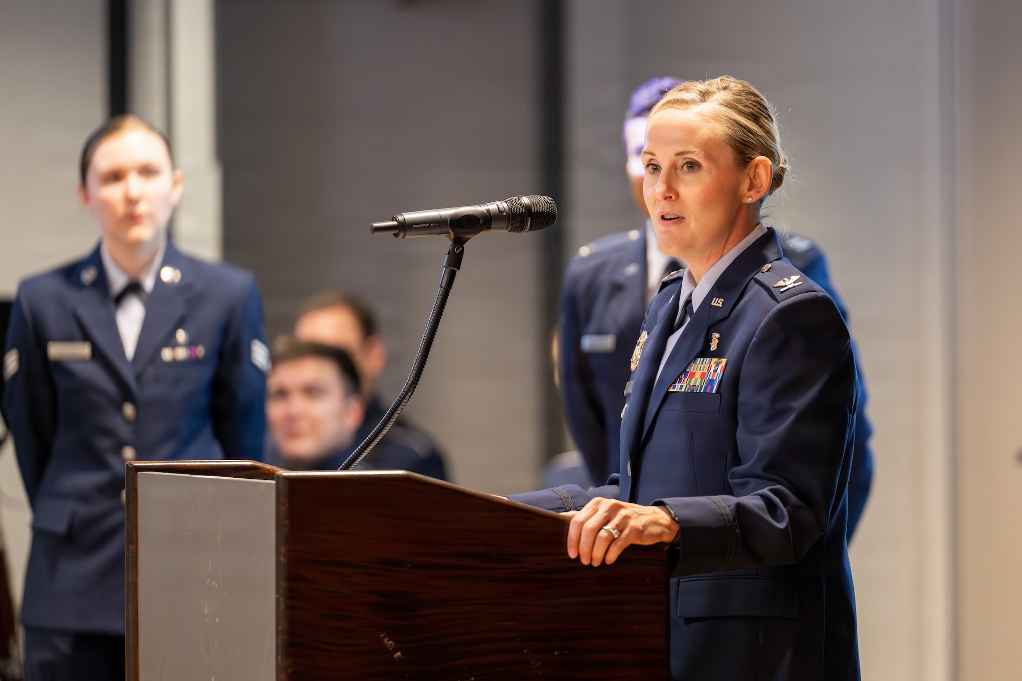 U.S. Air Force Col. Marcie Lewis, incoming 21st Medical Group commander, gives remarks during the 21st MDG change of command ceremony