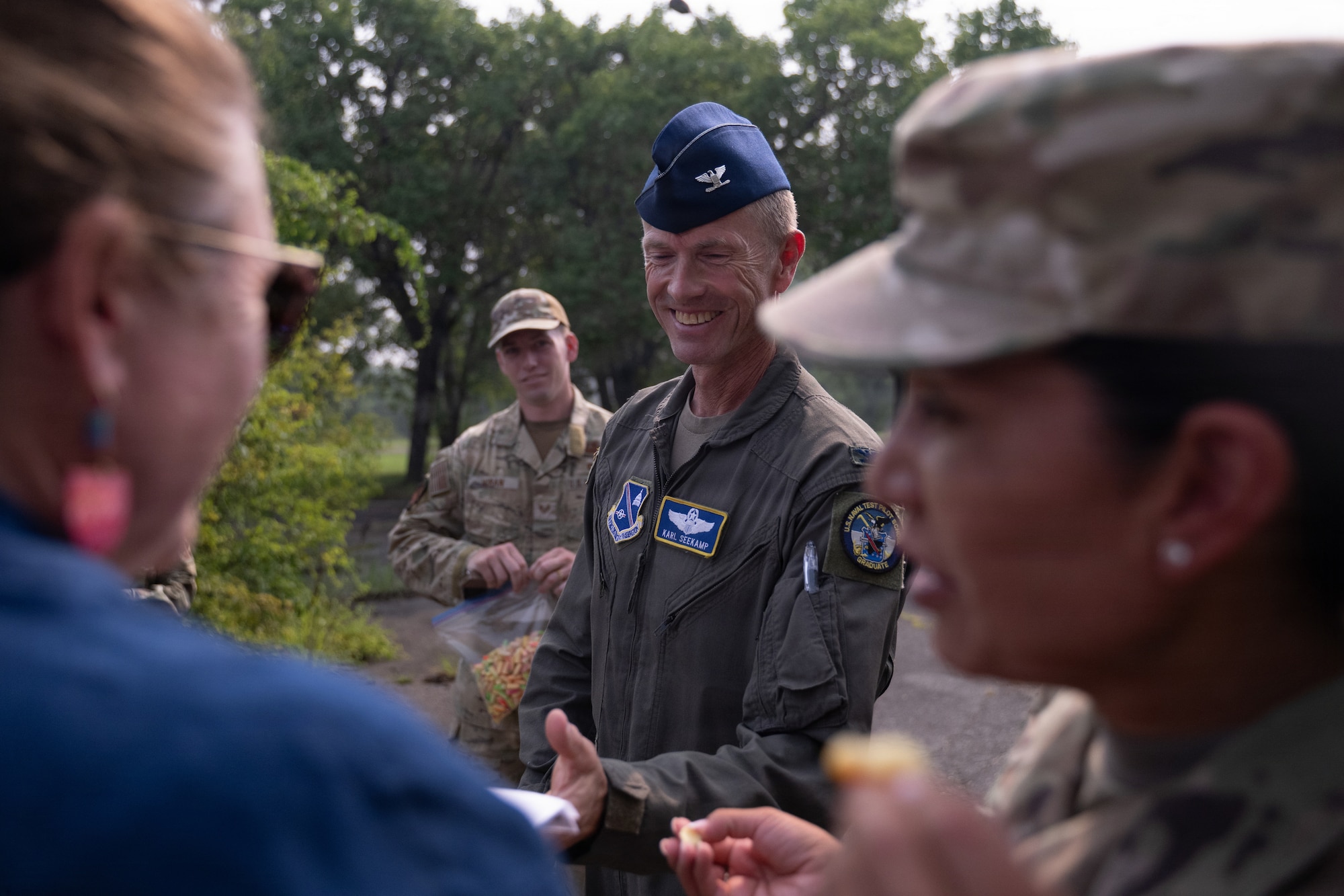 U.S. Air Force Col. Karl W. Seekamp, 316th Wing and installation commander, is greeted by Explosive Ordnance Disposal Airmen during his wing immersion.