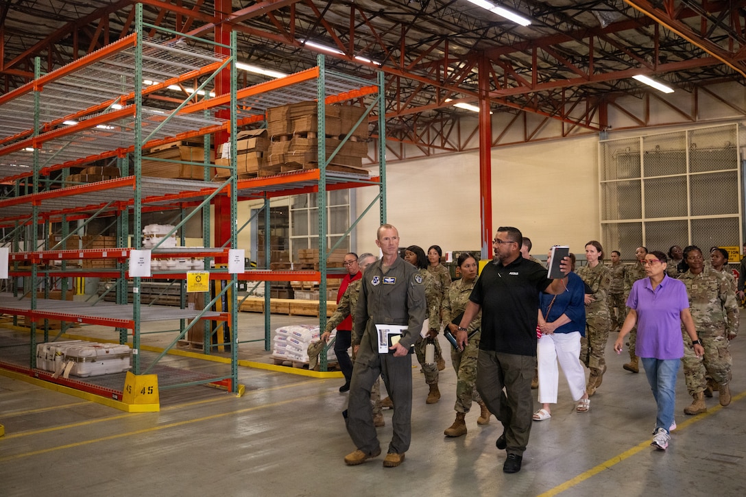 U.S. Air Force Col. Karl W. Seekamp, 316th Wing and installation commander, tours the Traffic Management Office cargo facility.