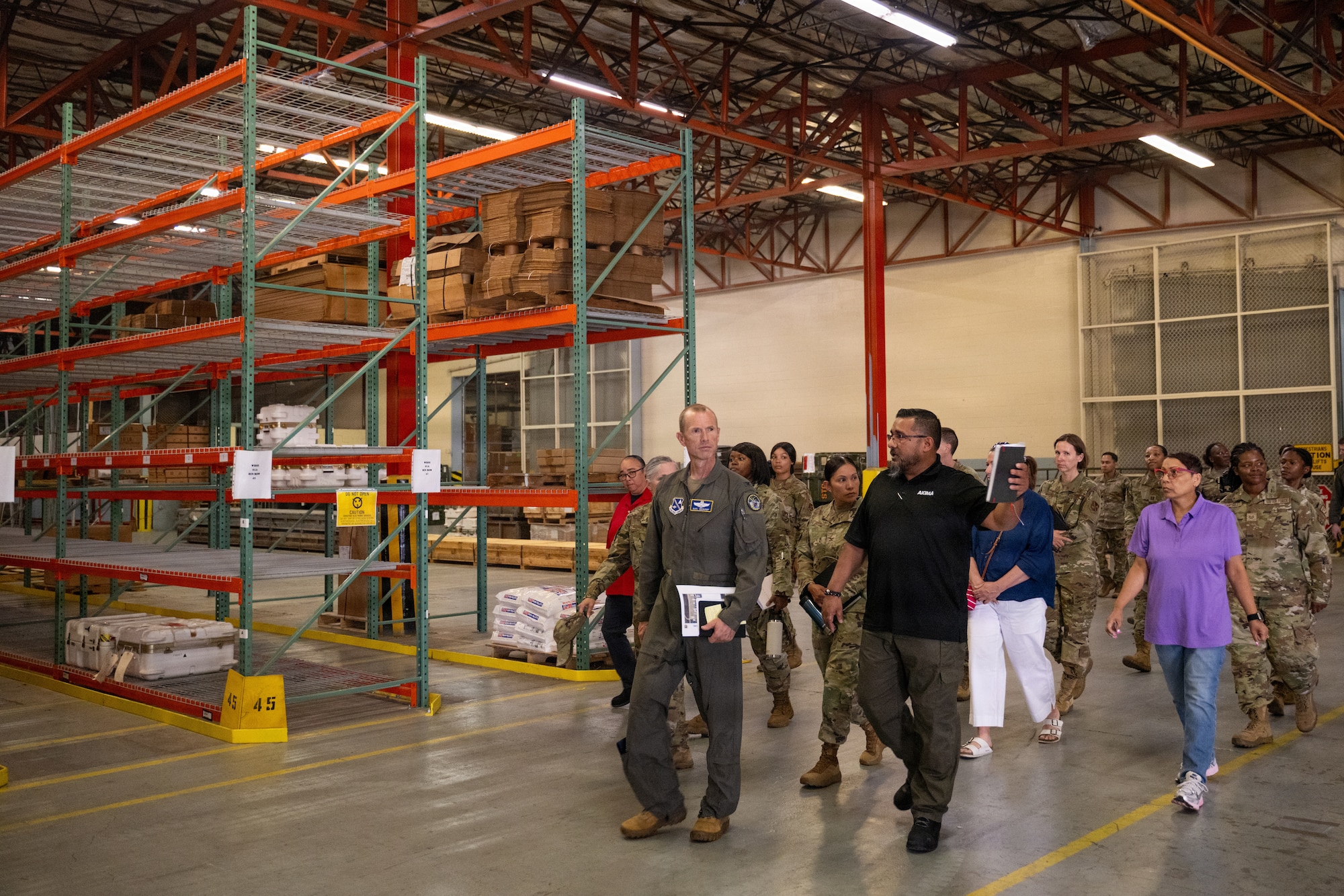 U.S. Air Force Col. Karl W. Seekamp, 316th Wing and installation commander, tours the Traffic Management Office cargo facility.