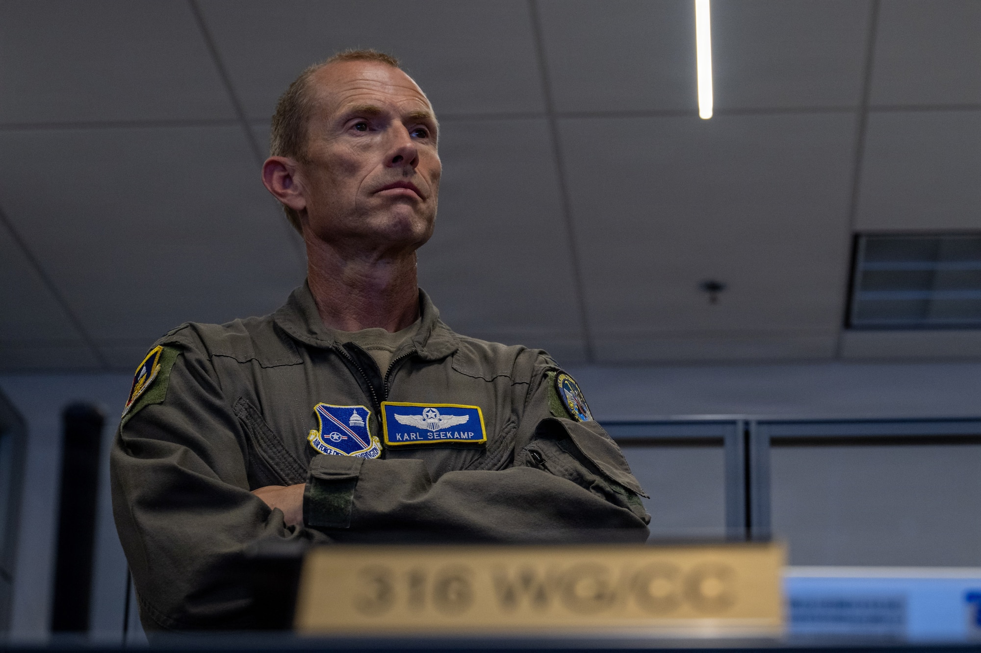U.S. Air Force Col. Karl W. Seekamp, 316th Wing and installation commander, tours the Wing Plans and Programming section during his wing immersion.