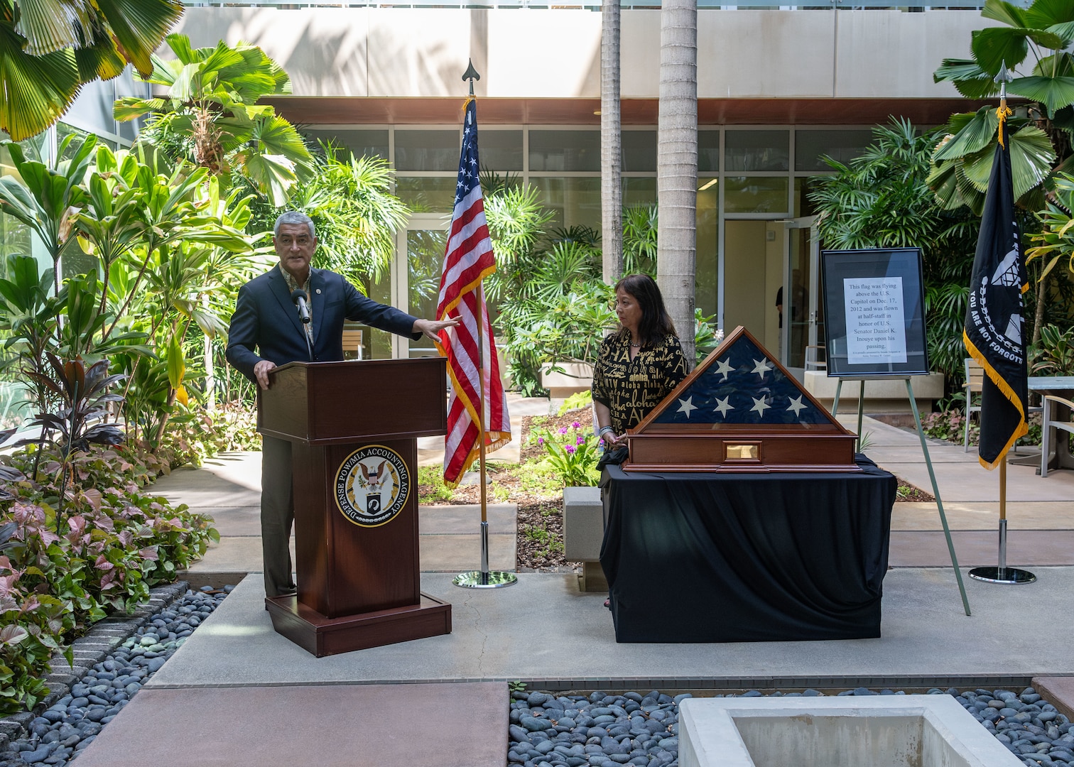 Kelly McKeague, Defense POW/MIA Accounting Agency Director, and Jennifer Sabas, Director of the Daniel K. Inouye Institute, speak during a flag presentation ceremony at Joint Base Pearl Harbor-Hickam, Hawaii, July 17, 2026.