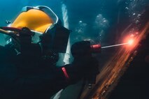 A New Zealand clearance diver welds into a mock ship hull during a salvage training dive during Exercise Rim of the Pacific 2026 in the Pacific Ocean off the coast of Oahu, Hawaii, July 14, 2026.