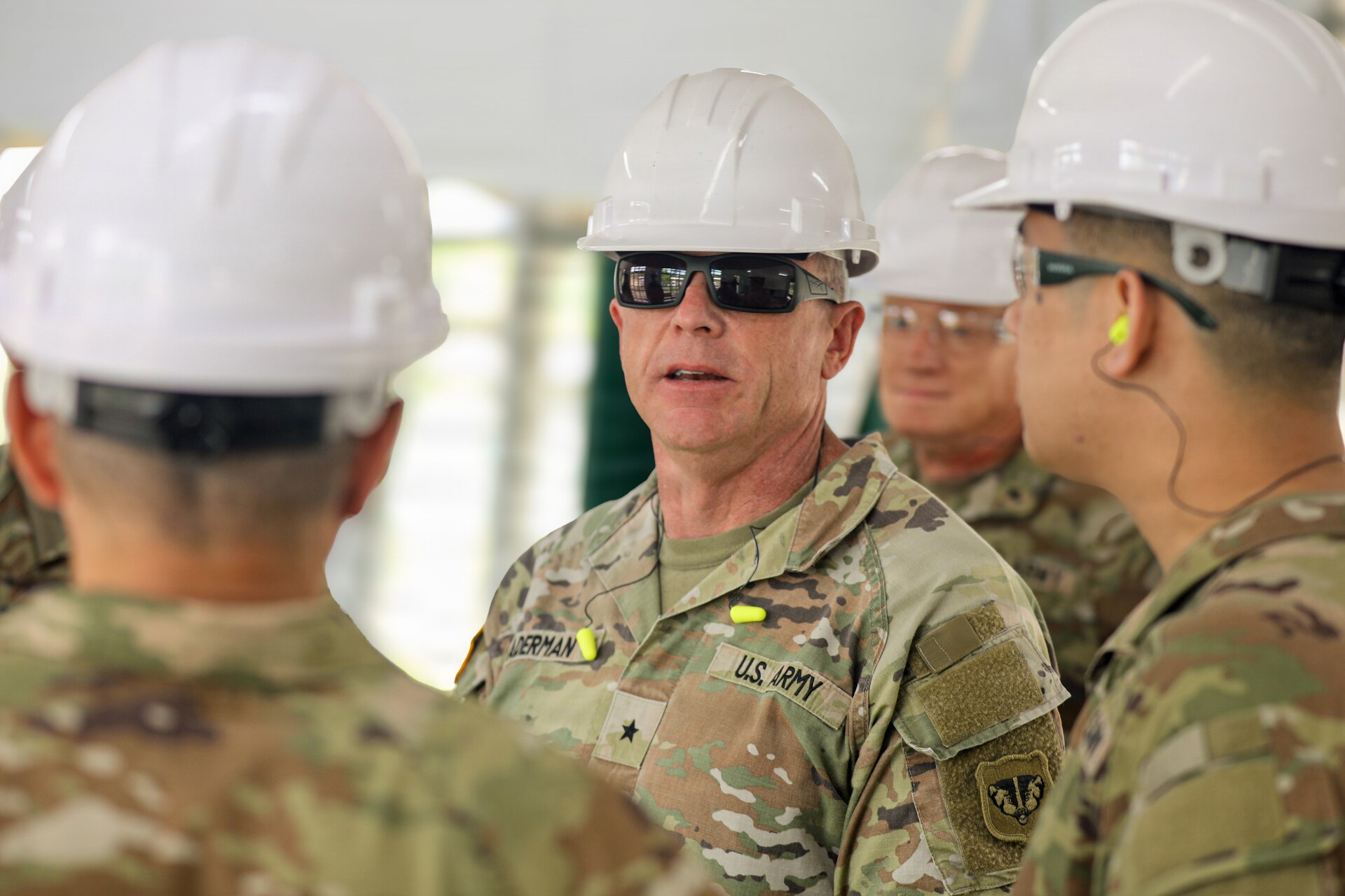 U. S. Army Brig. Gen. Brion J. Aderman, commander of the Wisconsin Army National Guard, conducts a walkthrough of an Igam Barracks classroom under renovation during Exercise Tamiok Strike 26 in Lae, Papua New Guinea, July 15, 2026.