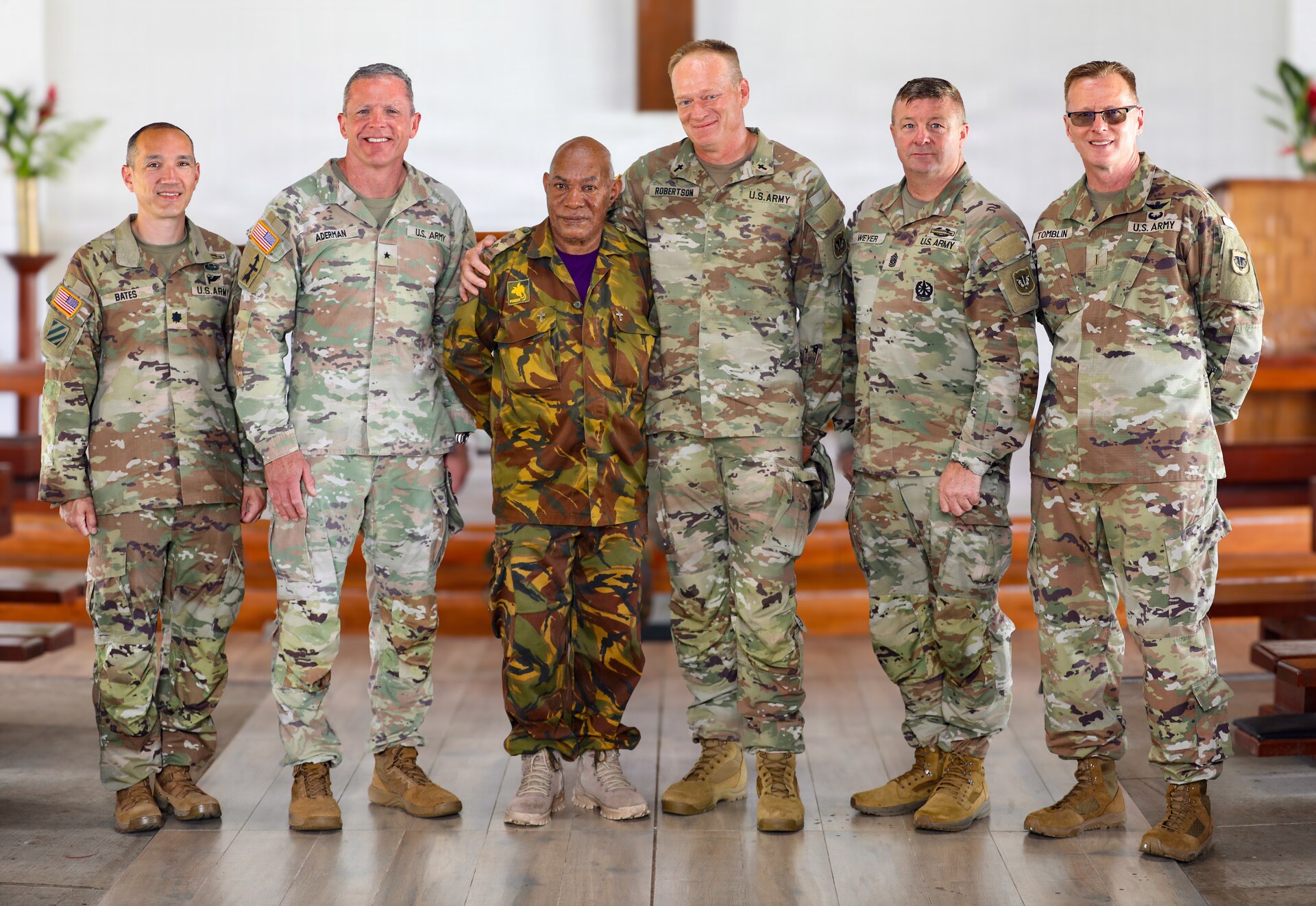 U.S. Army Brig. Gen. Brion J. Aderman, commander of the Wisconsin Army National Guard, second from left, poses with members of the Wisconsin Army National Guard command team and Papua New Guinea Defence Force Chaplain Norman Taylor at chaplain’s church at Igam Barracks during Exercise Tamiok Strike 26 in Lae, Papua New Guinea, July 15, 2026