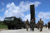 Capt. Alexander Vahadji (left) assigned to 7th Infantry Division (Multi-Domain Command - Pacific) Adm. Samuel J. Paparo (center) Commander of U.S. Pacific Command and Lt. Col. Alexander Mullin (right) assigned to 7th Infantry Division (Multi-Domain Command - Pacific) observe soldiers training with the Dark Eagle Long-Range Hypersonic Weapon during exercise Valiant Shield, June 2026.