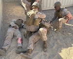 Navy chaplains and religious program specialists work together to practice delivering expeditionary religious ministry in austere environments during a mass casualty exercise on July 16, 2026, at Camp Wilson aboard Marine Corps Air Ground Combat Center Twentynine Palms, California. (Courtesy photo)