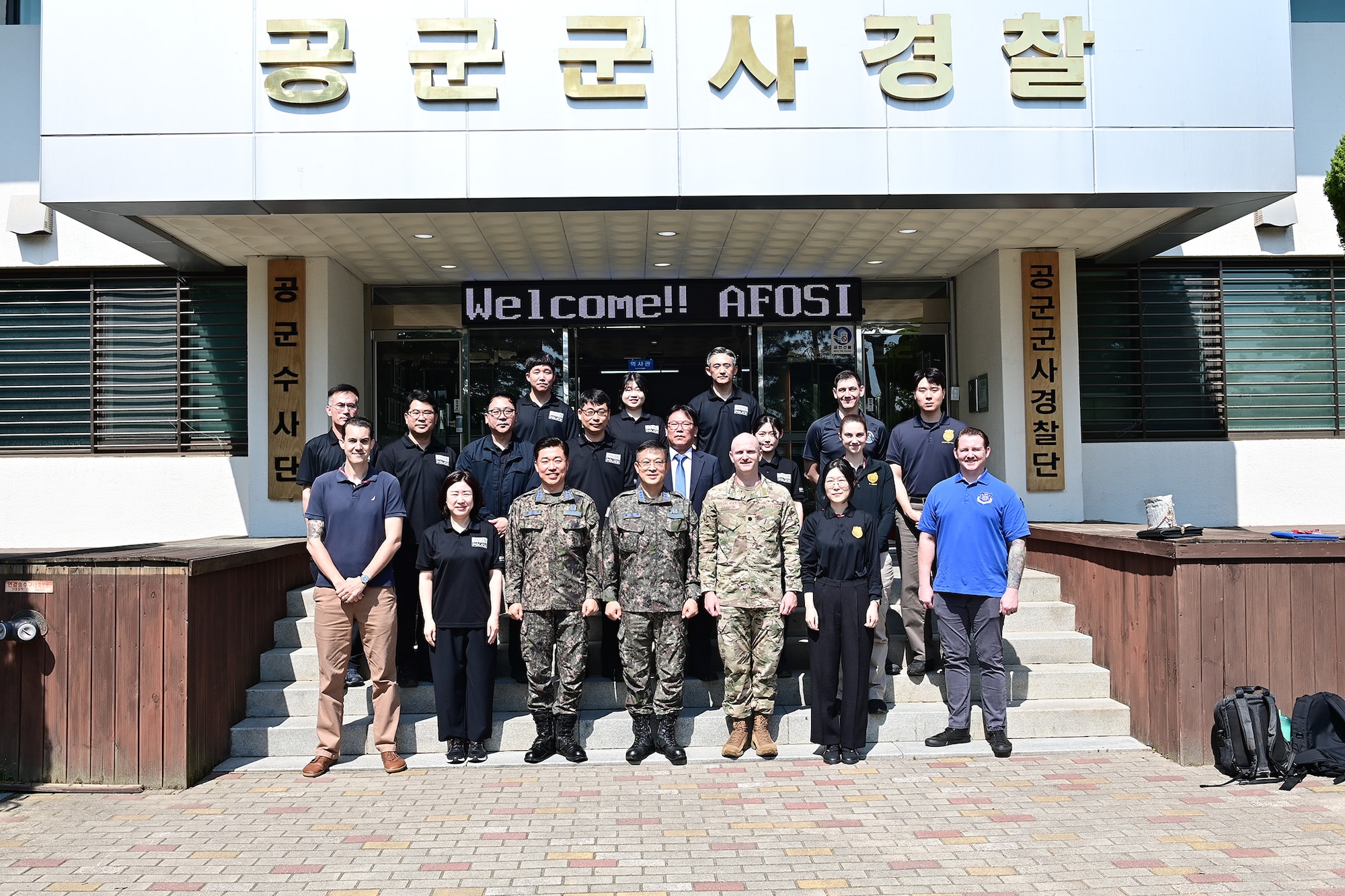Members of the Air Force Office of Special Investigations’ 5th Field Investigations Squadron and the Republic of Korea Air Force Investigative Agency pose for a group photo during a subject matter expert exchange May 14, 2026.