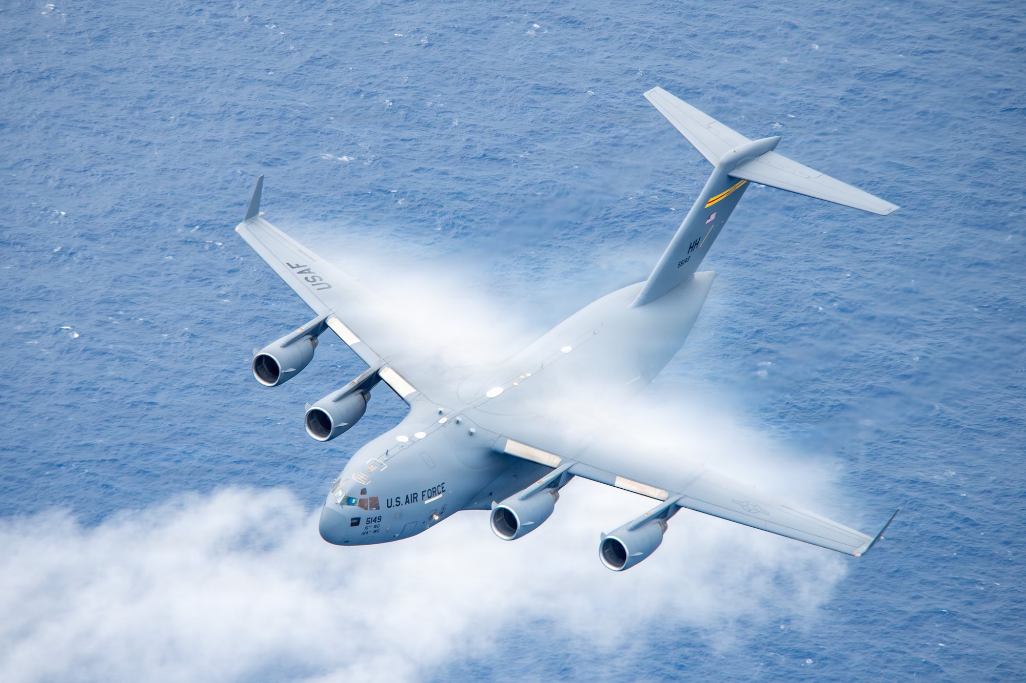 A U.S. Air Force C-17 Globemaster III piloted and crewed by the 204th Airlift Squadron, 154th Wing, Hawaii Air National Guard conducts a training sortie, Jan. 5, 2026. The ensuing flight included all aircraft types operated by the 154th Operations Group, showcasing the wing’s ability to project power across the Pacific. (U.S. Air National Guard photo by Senior Master Sgt. Mysti Bicoy)