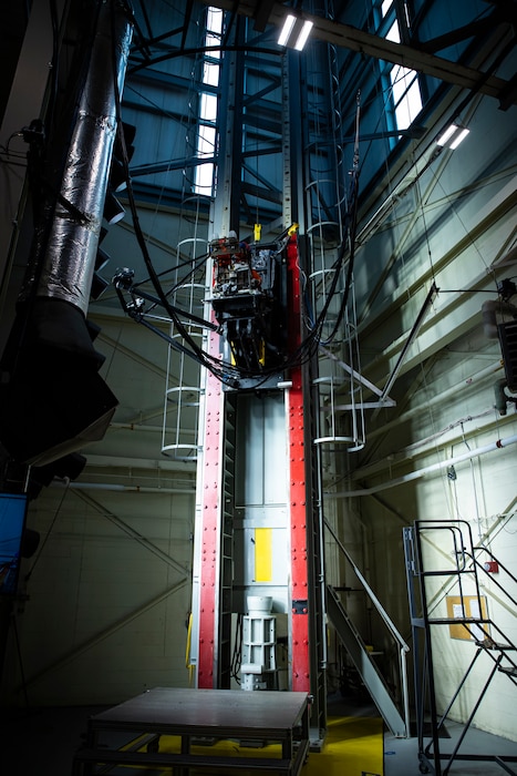 A U.S. Air Force volunteer tests the next replica of a space suit and seat for the Orion spacecraft in the vertical deceleration tower at Wright-Patterson Air Force Base, Ohio, Nov. 3, 2023. The Air Force Research Laboratory’s 711th Human Performance Wing sought active-duty military volunteers for an August 2026 collaborative study with NASA to evaluate the impact forces astronauts will face during future lunar landings.  (U.S. Air Force photo / Richard Eldridge)