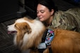 Pennsylvania Air National Guardsman Master Sgt. Jillian Dietrick, assigned to the Force Support, 171st Air Refueling Wing, Pennsylvania Air National Guard, visits with Ashoka, a certified therapy dog, July 8, 2026. Ashoka's visit helped boost morale and reduce stress among the Guardsmen who are responsible for maintaining the wings mission readiness. (U.S. Air National Guard photo by Tech. Sgt. Rebecca A. Wirth)