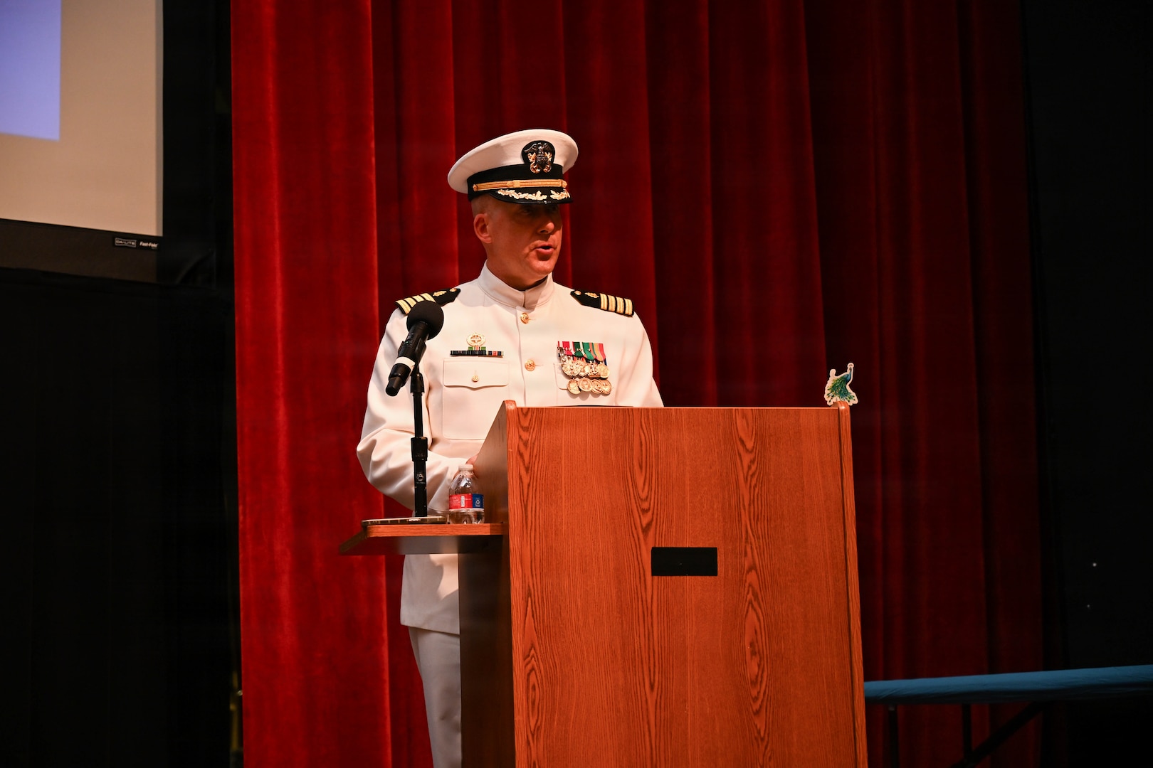 U.S. Navy Capt. Richard Lawrence, outgoing commanding officer, Navy Medicine Training Support Command, delivers remarks during a change of command ceremony by which U.S. Navy Capt. Lacy Gee relieved Lawrence as commanding officer, at Joint Base San Antonio-Fort Sam Houston, July 17, 2026. (U.S. Navy photo by Mass Communication Specialist Seaman Christine Walters)