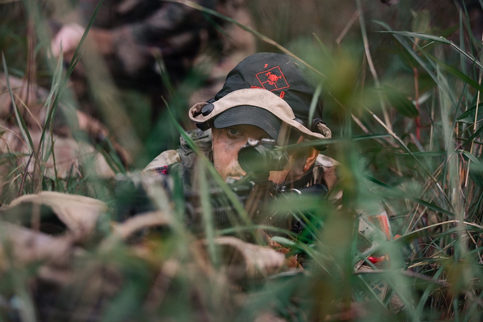U.S. Army Pfc. Grayson Flurry, an infantryman with 1st Battalion, 179th Infantry Regiment, 45th Infantry Brigade Combat Team, Oklahoma Army National Guard, pulls security during force-on-force tactical training at Exercise Keris Strike, or KS, near Kota Belud, Malaysia, July 19, 2026.