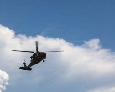 A UH-60 approaches a casualty pickup point during a joint medical evacuation training event with U.S. Army Soldiers from the 709th Medical Company (Area Support), Illinois Army National and members of the Malaysian army's 5th Infantry Division.