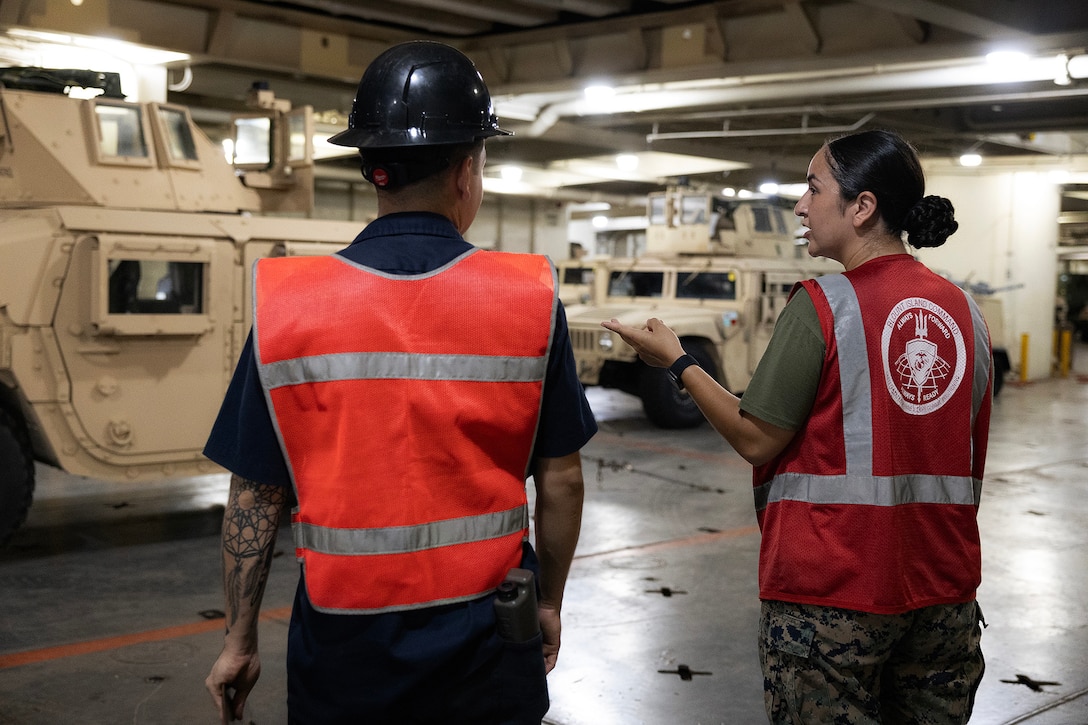U.S. Marine Corps Sgt. Edward Boyer, a mechanic assigned to 3rd Maintenance Battalion, 3rd Marine Logistics Group, speaks with Sgt. Mariah Aparicio, an embarker assigned to Blount Island Command's technical assistance and advisory team, during offload preparations July 14, 2026, aboard USNS Sisler near Pohang, South Korea. Blount Island Command personnel supported embarkation, equipment accountability and maritime sustainment during Combined Joint Logistics Over-the-Shore 26, which integrated U.S. and Republic of Korea lighterage and ship-to-shore connector capabilities. (U.S. Marine Corps photo by Dustin Senger)