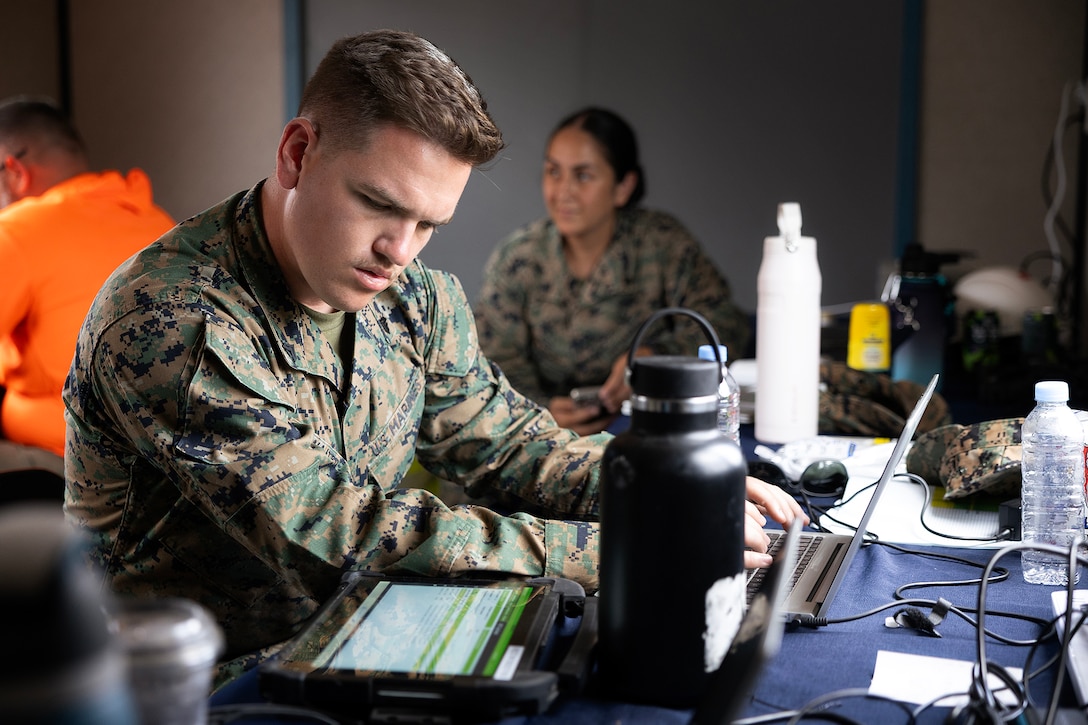 U.S. Marine Corps Cpl. Seth Waite, a supply quality assurance specialist assigned to Blount Island Command's technical assistance and advisory team, verifies equipment serial numbers during disassociation operations July 14, 2026, at a staging area in Pohang, South Korea. Blount Island Command personnel supported equipment accountability, embarkation and maritime sustainment during Combined Joint Logistics Over-the-Shore 26, which integrated U.S. and Republic of Korea lighterage and ship-to-shore connector capabilities. (U.S. Marine Corps photo by Dustin Senger)