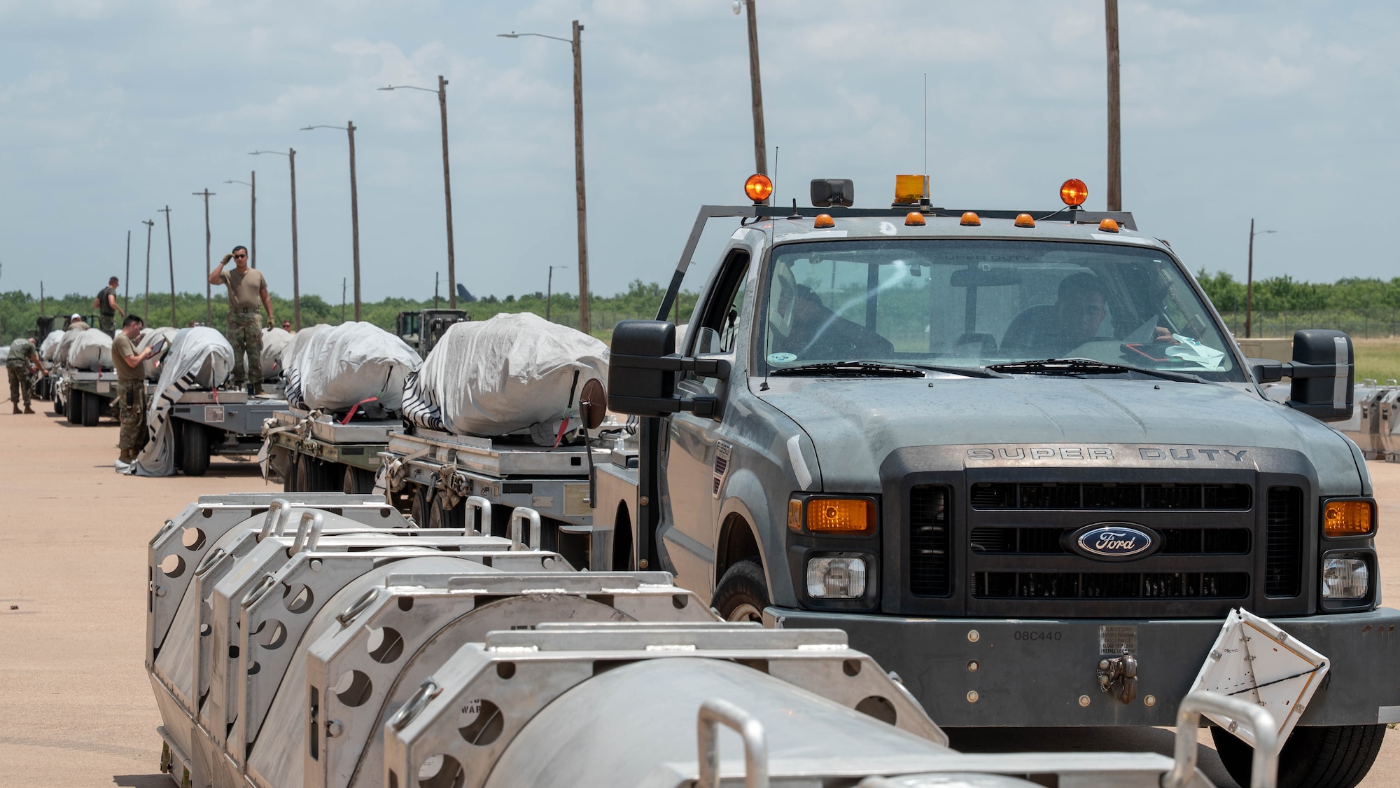 U.S. Air Force Joint Air-to-Surface Standoff Missiles sit staged on munitions trailers during the Death Strike: Trident Fury exercise at Dyess Air Force Base, Texas, June 22, 2026. Death Strike: Trident Fury is a multi-day munitions production exercise focused on strengthening joint interoperability and proving the joint force's ability to rapidly scale operations in a simulated combat environment. (U.S. Air Force photo by Airman 1st Class William Neal)