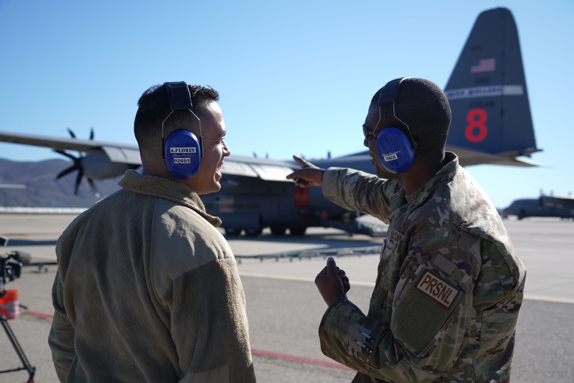 Master Sgt. Alan Franklin, a commanders support Airman with the 146th Airlit Wing, speaks to 1st. Lt. Aiden Flores about the MAFFS (Modular Airborne Fire Fighting System) mission on the flightline at Channel Islands Air National Guard Station, Port Hueneme, California on Jan. 13, 2025. C-130s equipped with MAFFS can drop up to 3,000 gallons of fire retardant in less than 10 seconds across a quarter-mile line. Aircraft from Air Force Reserve Command’s 302 AW, Peterson AFB, Colorado, the Air National Guard’s 153rd Airlift Wing, Cheyenne, Wyoming and the 152nd Airlift Wing, Reno, Nevada and the 146th Airlift Wing, Port Hueneme, California work together to combat fires throughout the activation. (U.S. Air National Guard photo by Tech. Sgt. Michelle Ulber)