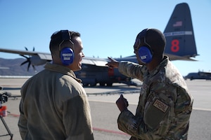 Master Sgt. Alan Franklin, a commanders support Airman with the 146th Airlit Wing, speaks to 1st. Lt. Aiden Flores about the MAFFS (Modular Airborne Fire Fighting System) mission on the flightline at Channel Islands Air National Guard Station, Port Hueneme, California on Jan. 13, 2025. C-130s equipped with MAFFS can drop up to 3,000 gallons of fire retardant in less than 10 seconds across a quarter-mile line. Aircraft from Air Force Reserve Command’s 302 AW, Peterson AFB, Colorado, the Air National Guard’s 153rd Airlift Wing, Cheyenne, Wyoming and the 152nd Airlift Wing, Reno, Nevada and the 146th Airlift Wing, Port Hueneme, California work together to combat fires throughout the activation. (U.S. Air National Guard photo by Tech. Sgt. Michelle Ulber)