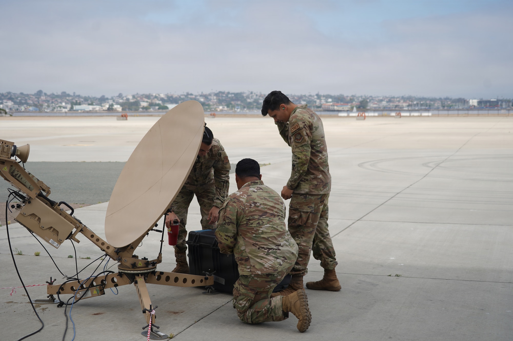 Members of the 146th Communications Flight, California Air National Guard, provide communications support during a Navy training exercise at Naval Air Station North Island, California, ensuring reliable connectivity and network operations for participating forces on April 11, 2026. The exercise provided the Airmen an opportunity to apply their technical expertise in a joint training environment while supporting mission readiness and interoperability among military partners. (U.S. Air National Guard photos by Tech. Sgt. Michelle Ulber)