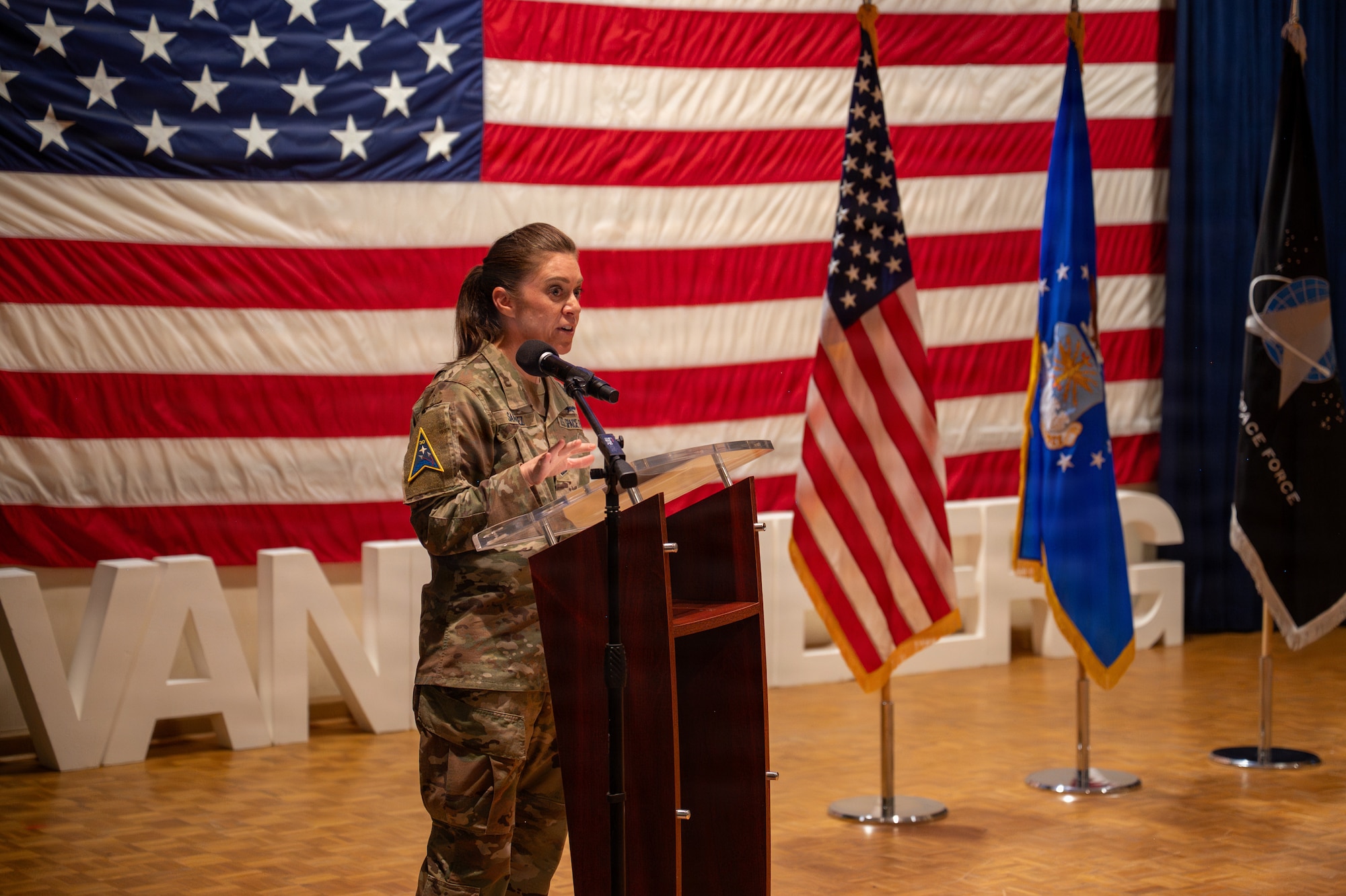 Person stands behind a podium and speaks