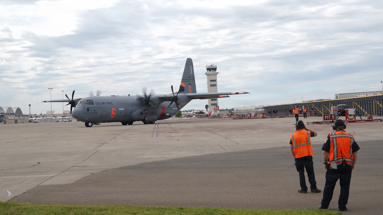 Airmen from the 146th Airlift Wing, 152nd Airlift Wing and the 302nd Airlift Wing train alongside CAL FIRE ground crews during their annual Modular Airborne Firefighting System (MAFFS) recertification training at McClellan Air Tanker Base, Sacramento, Calif. on April 20, 2026. The MAFFS  is a roll on and off system that enables a military C-130 aircraft to become a firefighting air tanker that can spread thousands of gallons of retardant along a quarter mile line, aiding ground crews to suppress wildfires. The training ensures that aircrews and support personnel remain qualified to operate the MAFFS system and fly into hazardous fire areas at any time of year. (U.S. Air National Guard photos by Tech. Sgt. Michelle Ulber)