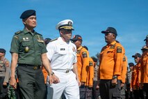 U.S. Navy (USN) Rear Adm. David Buzzetti, center, vice chief of the USN Bureau of Medicine and Surgery, and Indonesian National Armed Forces (Tentara Nasional Indonesia) Maj. Gen. Hadi Juanda, TNI surgeon general, inspect the troops during the PP26 Indonesia mission stop opening ceremony in Sibolga, Indonesia, July 21, 2026.