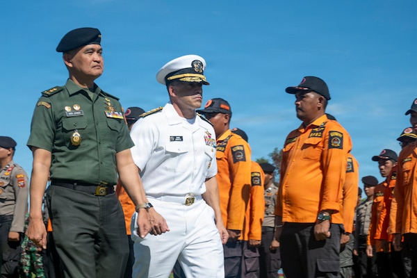 U.S. Navy (USN) Rear Adm. David Buzzetti, center, vice chief of the USN Bureau of Medicine and Surgery, and Indonesian National Armed Forces (Tentara Nasional Indonesia) Maj. Gen. Hadi Juanda, TNI surgeon general, inspect the troops during the PP26 Indonesia mission stop opening ceremony in Sibolga, Indonesia, July 21, 2026.