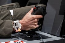 U.S. Air Force Capt. Daniel Lee, 13th Fighter Squadron F-35 pilot, uses an F-35 Emulated Non-Operational Flight Program Interoperability Experience simulator in support of VALIANT SHIELD 2026 at Misawa Air Base, Japan, June 30, 2026.