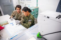 U.S. Army Sgt. Alex Peña, assigned to 62nd Medical Brigade, trains Philippine Army Pfc. Emberlyn Mendoza on a man-portable diagnostic system during Exercise Balikatan 2026 at Fort Magsaysay, Philippines, April 30, 2026.