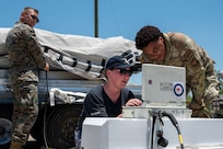 Members of the U.S. Air Force, U.S. Marine Corps and Royal Australian Air Force perform critical testing on a Joint Air-to-Surface Standoff Missile[SS1.1] during the Death Strike: Trident Fury exercise at Dyess Air Force Base, Texas, June 24, 2026. The joint munitions training focused on testing and proving agile combat deployment strategies in rugged, remote locations. (U.S. Air Force photo by Airman 1st Class William Neal)