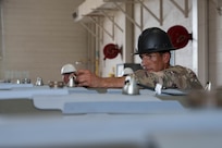 A U.S. Airman assigned to the 7th Munitions Squadron arms a Joint Direct Attack Munition during the Death Strike: Trident Fury exercise at Dyess Air Force Base, Texas, June 22, 2026. The multi-day munitions production exercise focused on strengthening interoperability and proving the joint force's ability to rapidly scale operations in a simulated combat environment. (U.S. Air Force photo by Airman 1st Class William Neal)