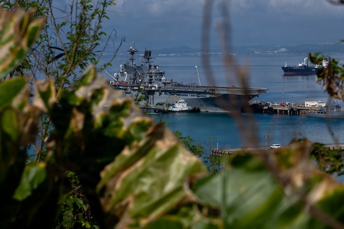 America-class amphibious assault ship USS Tripoli (LHA 7) and embarked 31st Marine Expeditionary Unit arrive at White Beach Naval Facility, Okinawa, Japan, after concluding a dynamic six-month deployment to the U.S. 5th and 7th Fleet areas of operation, July 22, 2026. Tripoli is forward deployed to Sasebo, Japan, and the flagship of Expeditionary Strike Group (ESG) 7 / Commander, Task Force (CTF) 76. Within the U.S. 7th Fleet area of operations, ESG7 / CTF-76 is responsible for conducting expeditionary warfare operations with Navy and Marine Corps capabilities to support theater contingencies that range from crisis response to full combat operations. U.S. 7th Fleet, the Navy’s largest forward-deployed numbered fleet, routinely interacts and operates with allies and partners in preserving a free and open Indo-Pacific. (U.S. Navy photo by Mass Communication Specialist 2nd Class Danilo Reynoso)