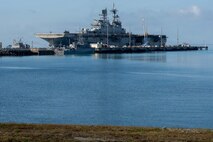 America-class amphibious assault ship USS Tripoli (LHA 7) and embarked 31st Marine Expeditionary Unit arrive at White Beach Naval Facility, Okinawa, Japan, after concluding a dynamic six-month deployment to the U.S. 5th and 7th Fleet areas of operation, July 22, 2026. Tripoli is forward deployed to Sasebo, Japan, and the flagship of Expeditionary Strike Group (ESG) 7 / Commander, Task Force (CTF) 76. Within the U.S. 7th Fleet area of operations, ESG7 / CTF-76 is responsible for conducting expeditionary warfare operations with Navy and Marine Corps capabilities to support theater contingencies that range from crisis response to full combat operations. U.S. 7th Fleet, the Navy’s largest forward-deployed numbered fleet, routinely interacts and operates with allies and partners in preserving a free and open Indo-Pacific. (U.S. Navy photo by Mass Communication Specialist 2nd Class Danilo Reynoso)