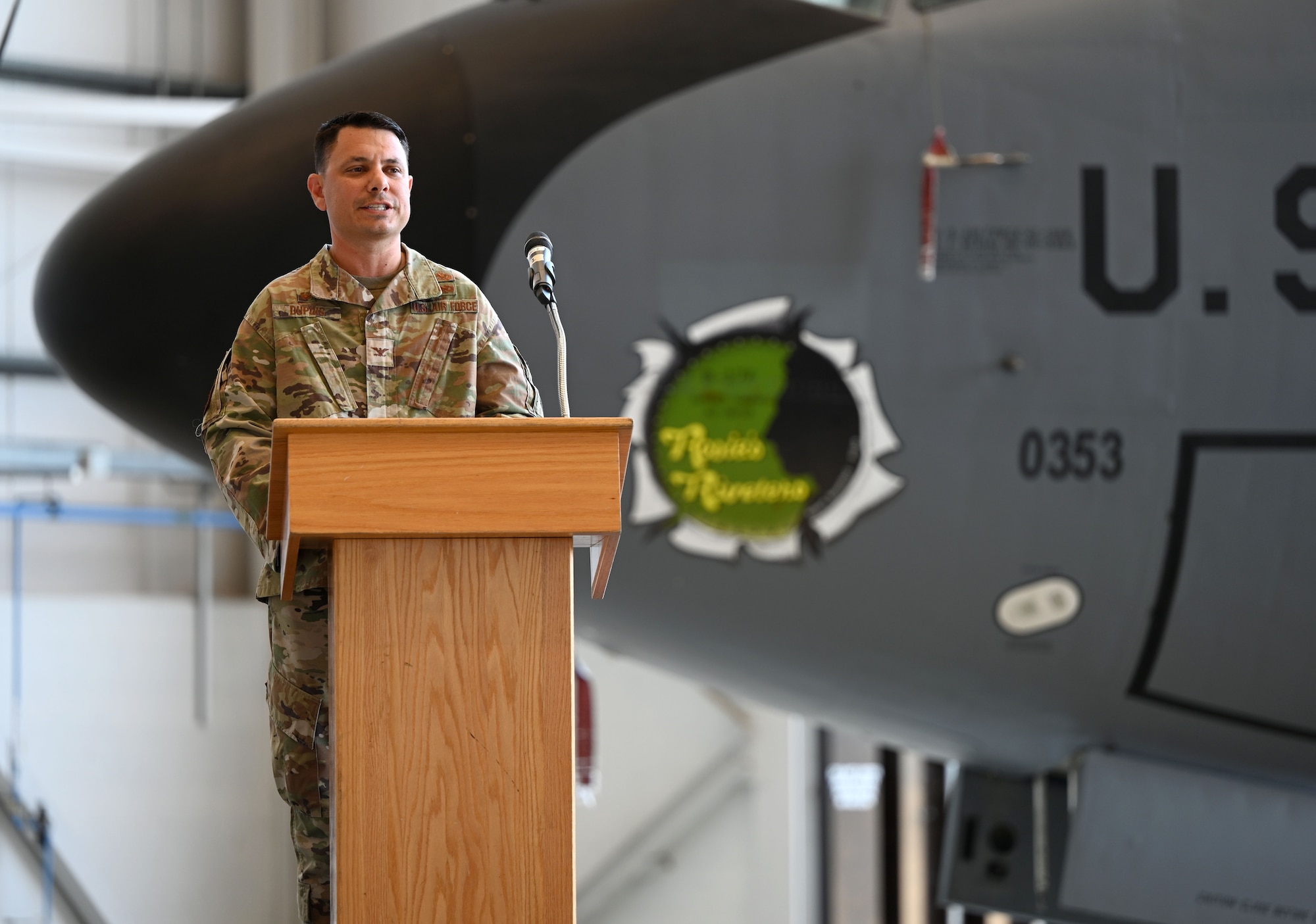 U.S. Air Force Col. Christopher Dupuis, 100th Maintenance Group commander, gives his opening remarks to the audience and members of the 100th MXG at the change of command ceremony at RAF Mildenhall, England, June 26, 2026. The change of command ceremony is a time-honored tradition in which one officer relinquishes command and passes it to another. (U.S. Air Force photo by Karen Abeyasekere)