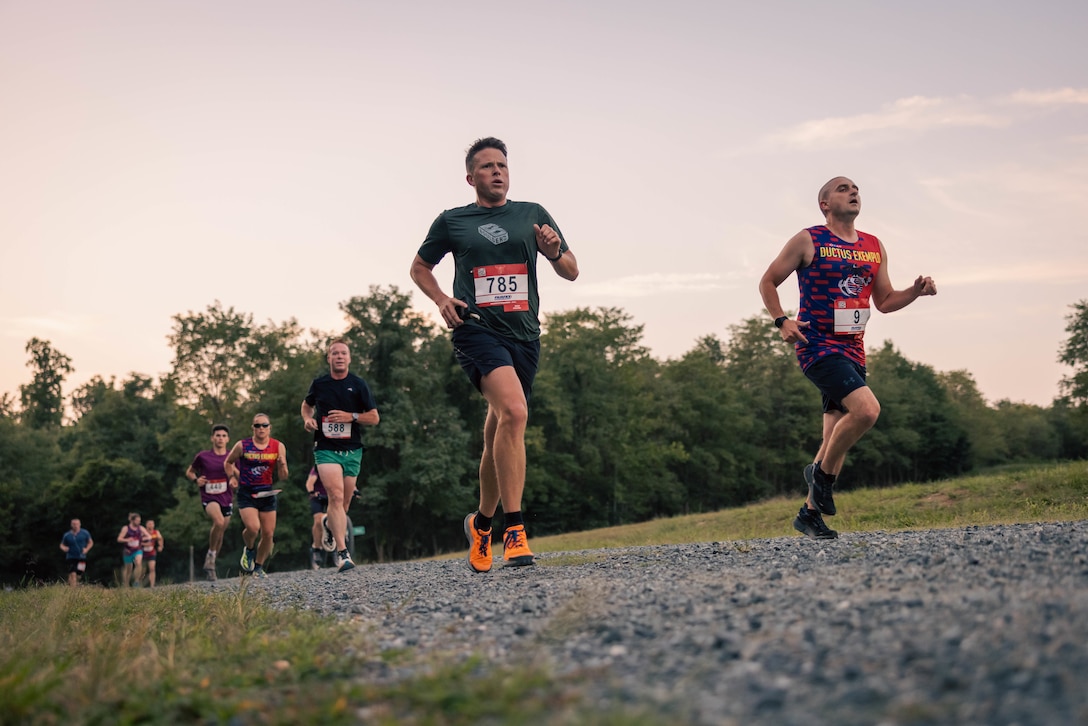 Runners participate in the Quantico 12K on Marine Corps Base Quantico, Virginia, Aug. 24, 2024. The event challenged runners and their individual tenacity as they ran 7.46 miles of trails through the woods of MCB Quantico's Officer Candidates School. (U.S. Marine Corps photo by Lance Cpl. Joaquin Dela Torre)